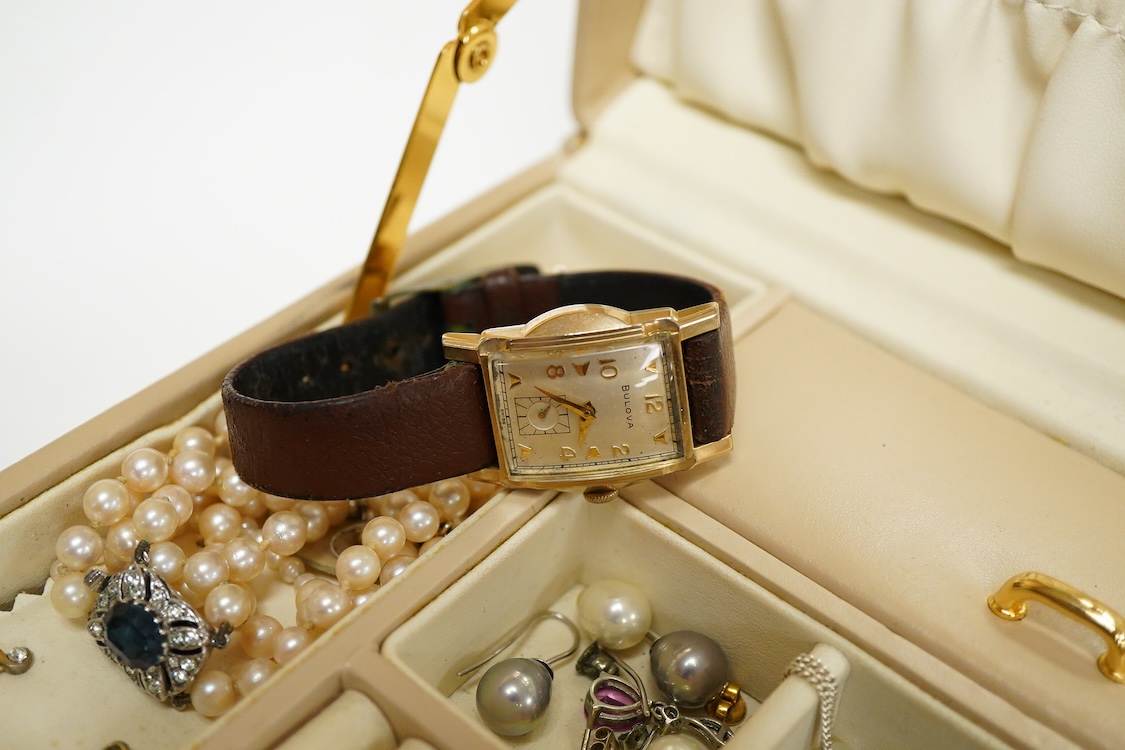 A jewellery box containing mainly costume and other jewellery including, silver and 925 cufflinks, a cultured pearl necklace with silver and paste set clasp and three wrist watches including a steel and gold plated Bulov